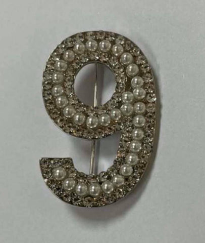 Nine brooch